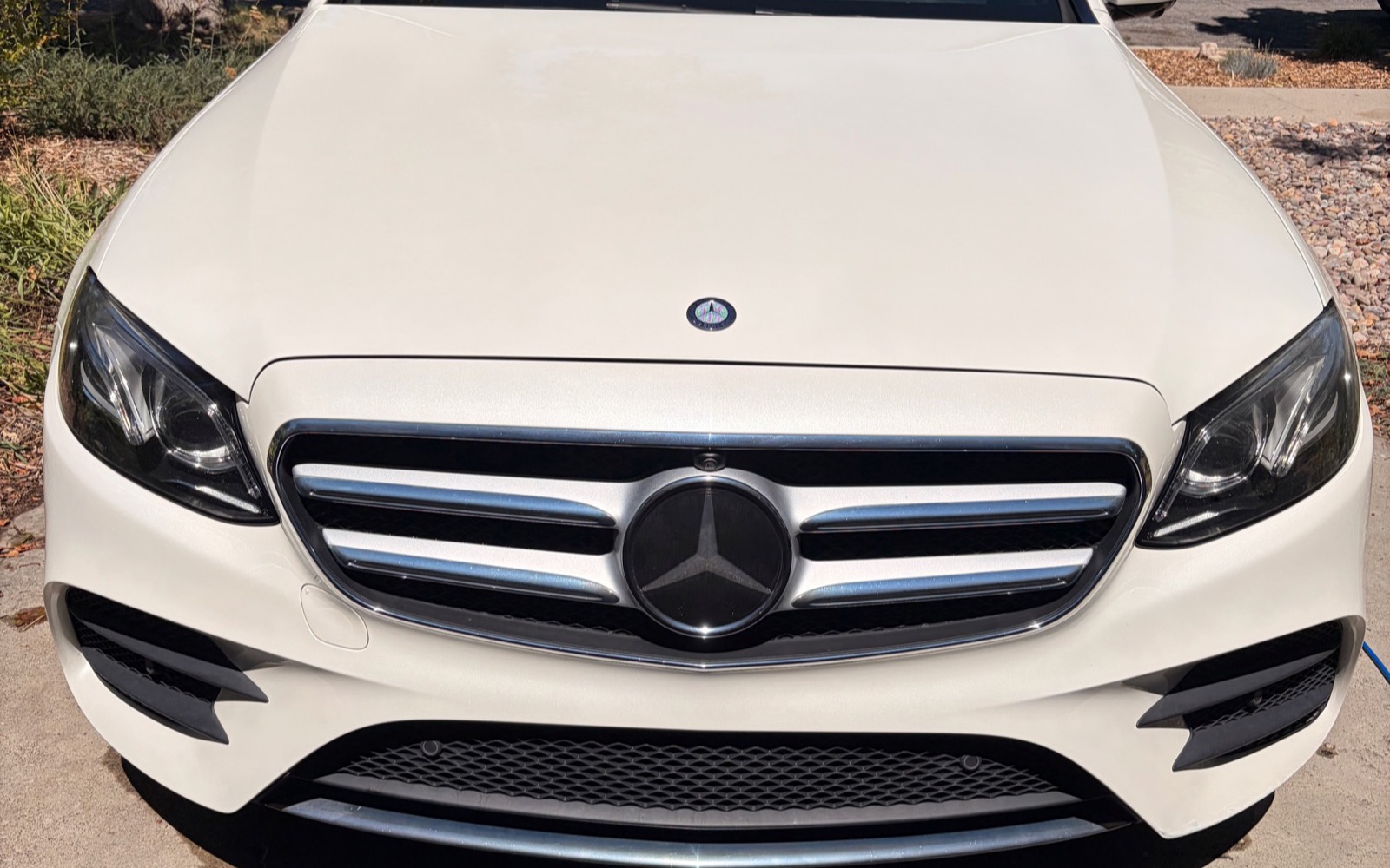Glossy, freshly detailed exterior finish on a Mercedes-Benz sedan
